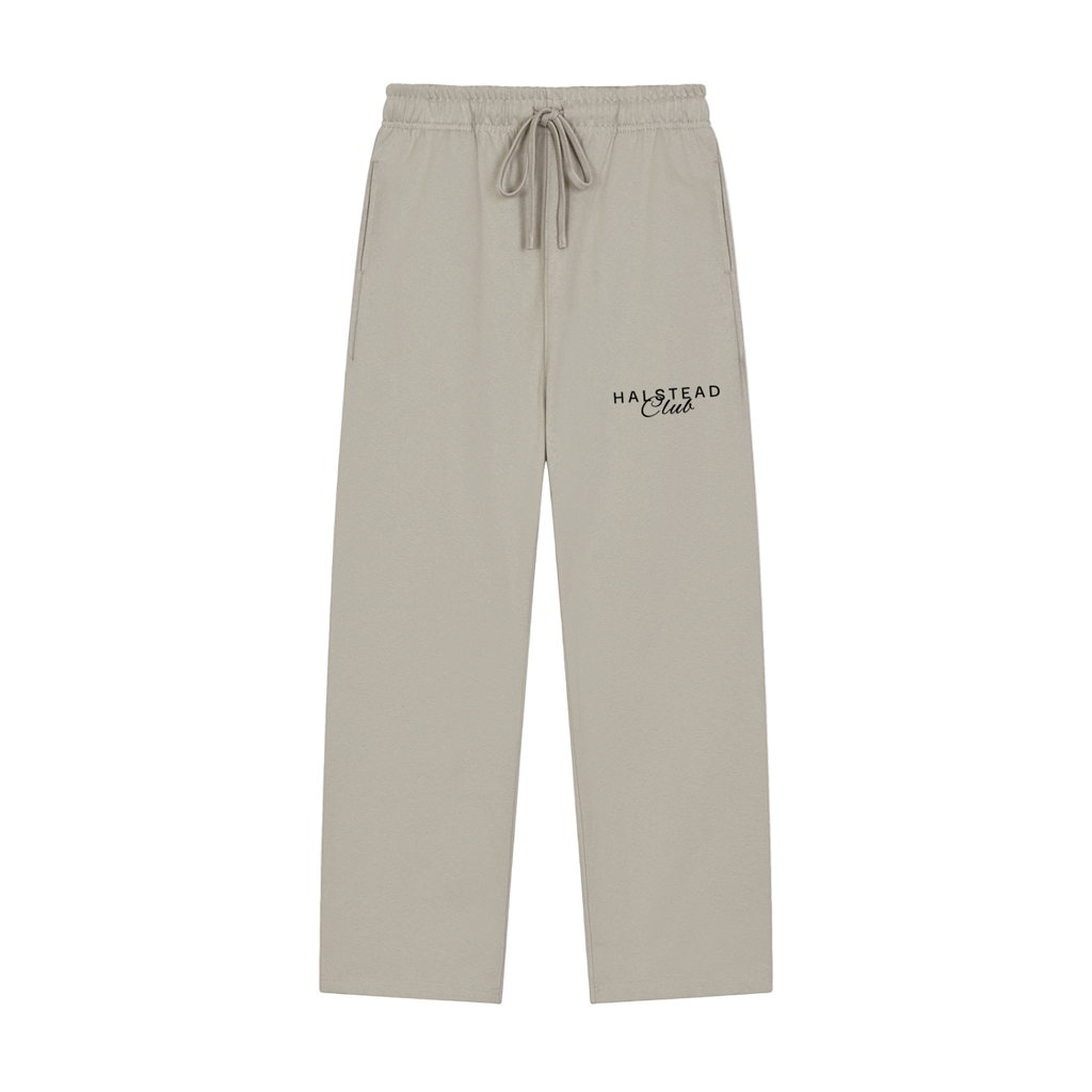 Beige sweatpants with 'Halstead Club' embroidery on a white background