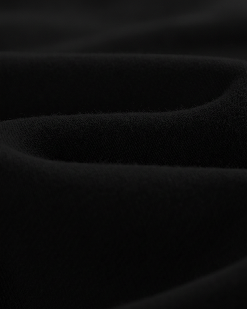 Dark textured fabric with wavy pattern
