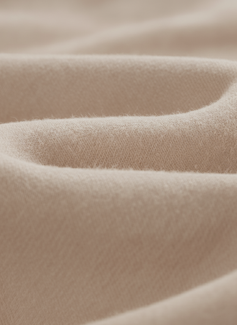 Close-up of beige fabric with a soft texture