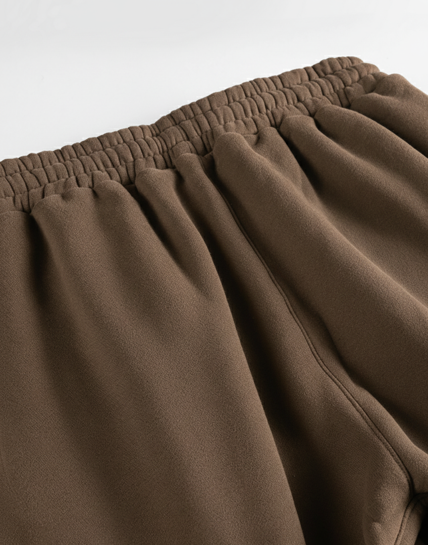 Brown fabric with an elastic waistband on a white background