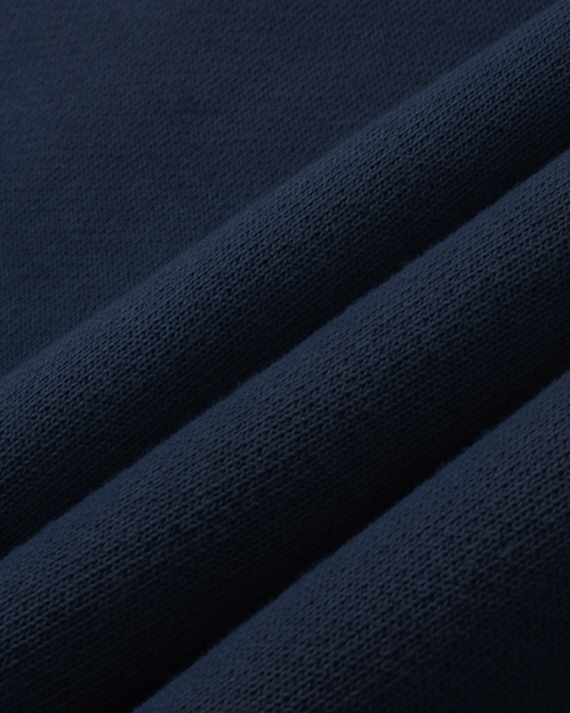 Close-up of dark blue fabric with a textured pattern