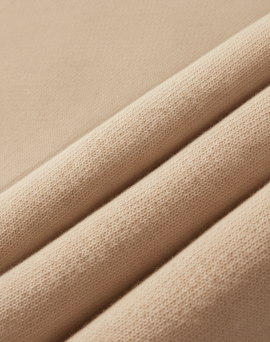 Close-up of beige fabric with a subtle texture